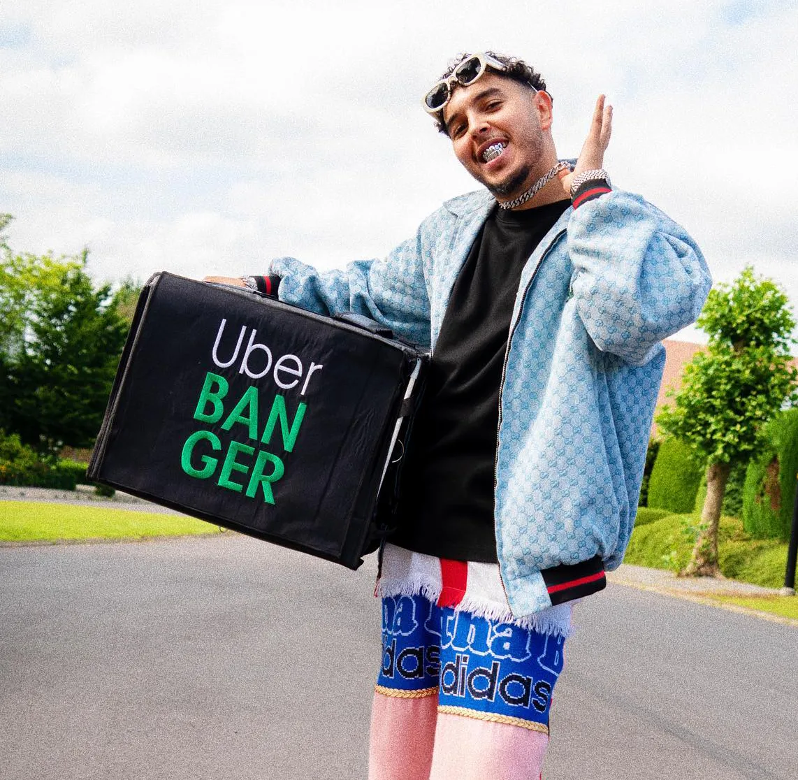 Icon holding his Uber Banger bag under his arm